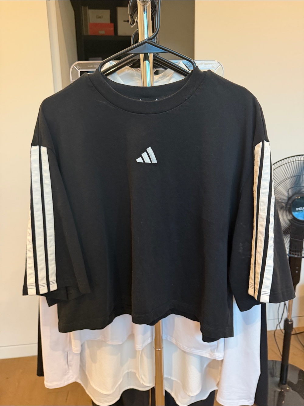 Adidas women's' Black Cropped Tee with White Sleeve Stripes.